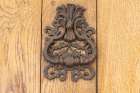 Aigues-Mortes-Gard-Occitania-France An old rusted knocker on a wooden door Art Print